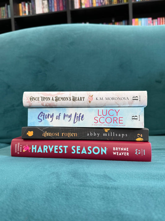 Fall romance book stack featuring Harvest Season, Almost Rotten, Story of My Life, RUMORS & WHISKEY, Once Upon a Demon’s Heart, and The Night Prince.